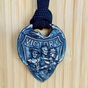 Vintage bronze pendant celebrates US Labor movement.